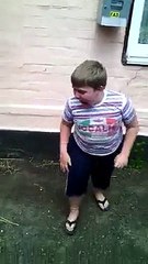 Fat kid scared by tiny puppy is just hilarious!