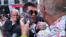Simon Cowell is very excited to be a dad and a reporter asks him for money!!!