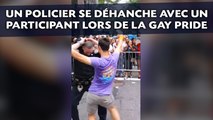 Un policier se déhanche avec un participant lors de la Gay Pride
