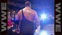 Big Show punches through Triple H's chair and a monitor