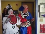 Clowns perform circus acts for hospital patients