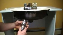 Old plumber shows how to install a drain on a bathroom sink (basin).Mechanical P.O.plug