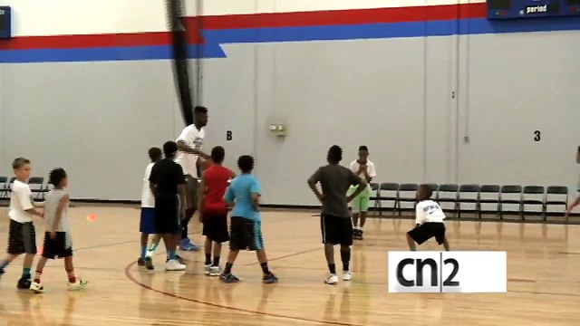 NBA player dunk over little Kid At Basketball Camp - Nerlens Noel - 76ers