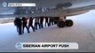 Airplane Pushing Stunt at Siberian Airport: Passengers push plane down runway in -50 C