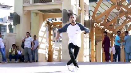 boy is dancing in the streets of dubai