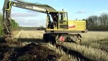 Åkermans excavator digging out a water filled ditch 2012