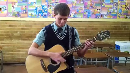 A very talented guitar player! Just showing a trick he mastered..