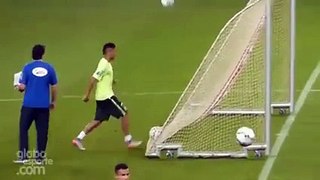 Neymar Jr. scores a behind the goal goal at Brazil training .