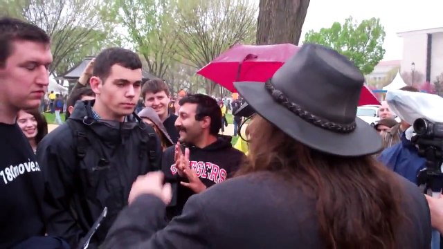 Aron Ra has words with a couple of Ray Comfort followers & is interrupted by...