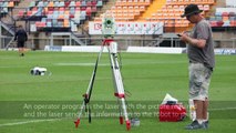 3D signs being painted on a football field