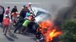 (ENTIRE FOOTAGE) Motorcyclist under burning car: RESCUED by crowd of bystanders