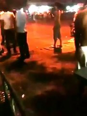 A group of youth gangster fighting a long the street like cinema performance