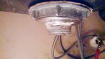 Remove stuck kitchen sink drain strainer basket--with a hacksaw.