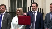 Britain takes axe to spending in new austerity drive