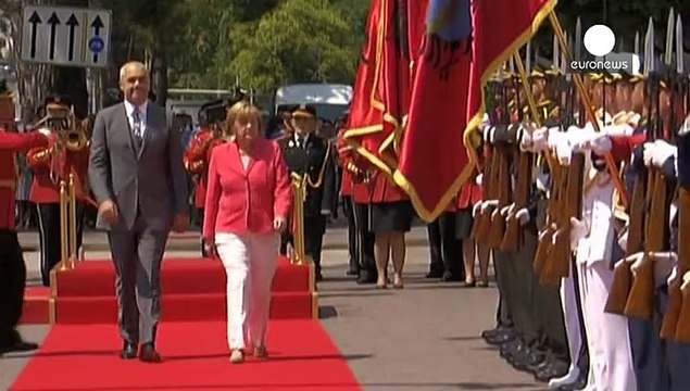 Merkel breaks off dealing with Greece to visit Balkans