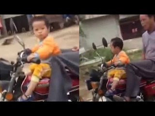 Bizarre video of toddler being taught to ride motorbike in China