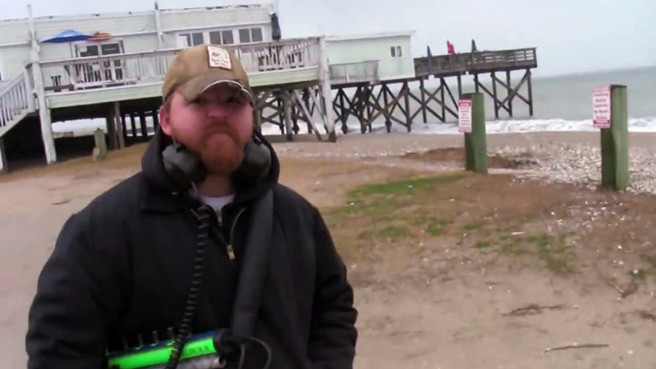 Metal detecting: A nasty rainy beach day and some odd finds...