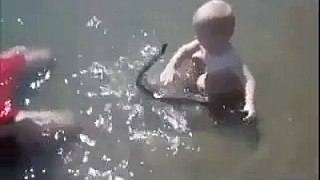Toddler Playing with Real Snake