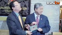 Zahid gives Guan Eng his 'first IC'