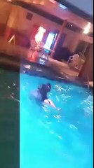Girl thrown in pool