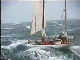 Sailingyacht between big waves sailing