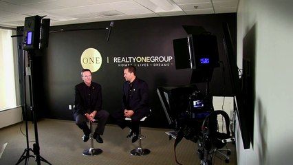 Kuba Jewgieniew of Realty ONE Group talks to John Hall & Associates
