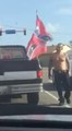 Guy ripped confederate flag off a truck in the middle of traffic!