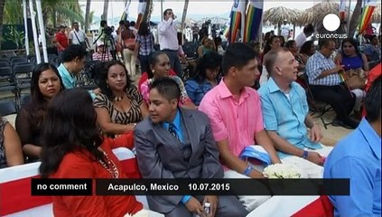 Gay couple hold mass beach wedding
