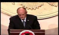 Giuliani answers his phone during NRA speech