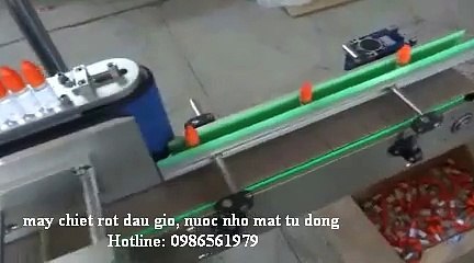 máy chiết rót, đóng nắp chai dầu gió , thuốc nhỏ mắt 0986561979