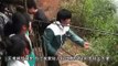 Chinese children travel down zip-line (flying fox) across abyss to and from school