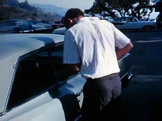 how to open a locked car with a coat hanger
