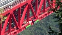 Dangerous stunts: Daredevil acrobat Eskil Ronningsbakken performs on China's Aizhai bridge