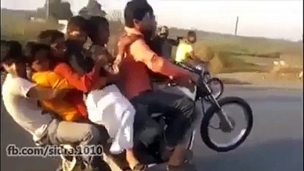 Seven boys on bike and doing one wheeling