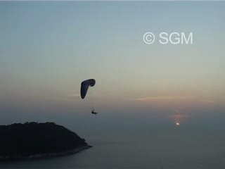Paragliding in Phuket Thailand at sunset