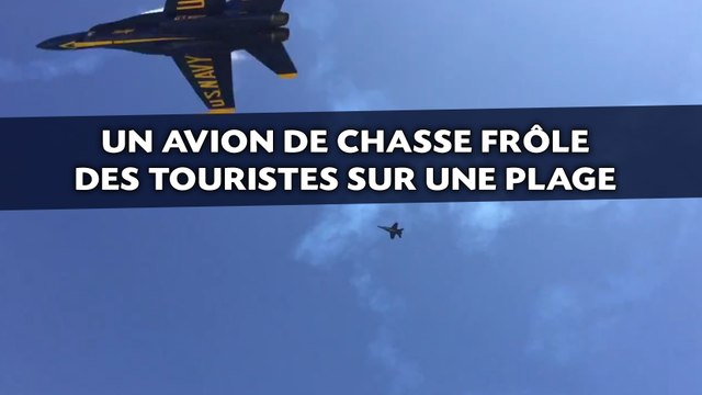Un avion de chasse frôle des touristes sur une plage