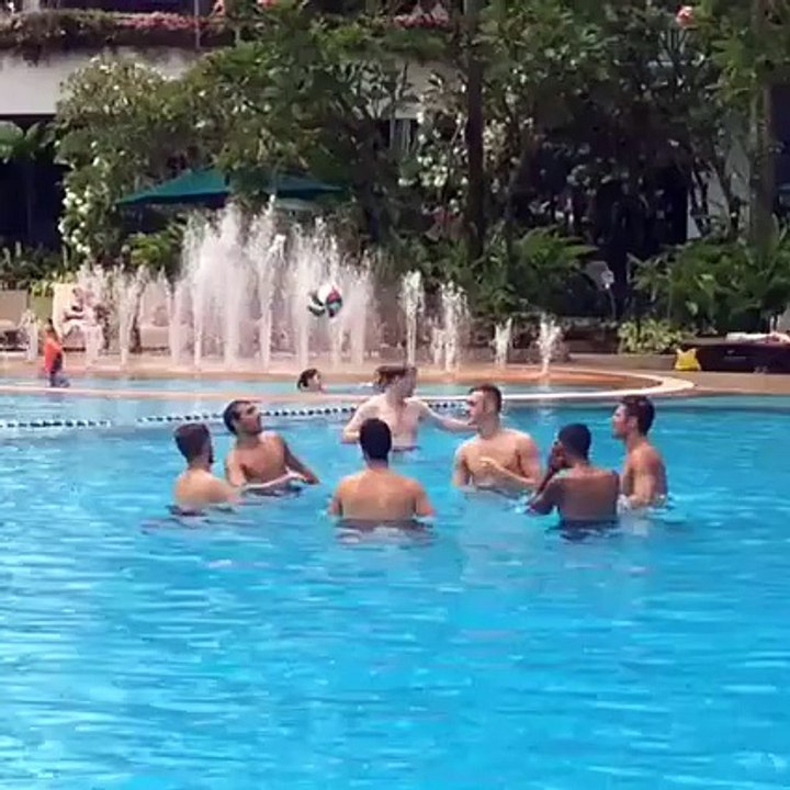 Arsenal players playing at the pool