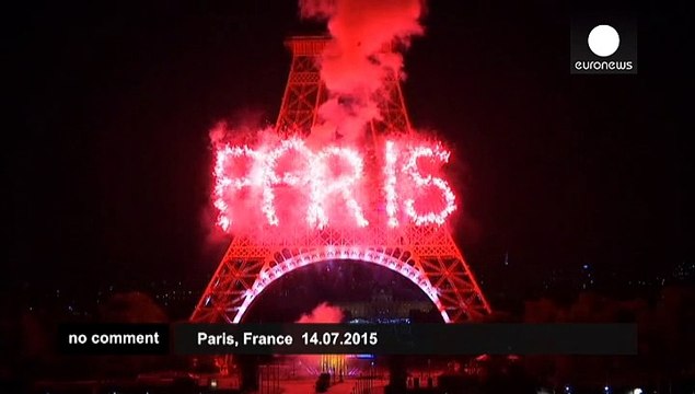 Eiffel Tower lit up by fireworks for Bastille Day