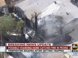 Possible hoarding home catches fire in Peoria