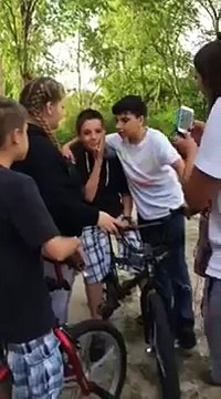 Kid tricks girl into kissing him on lips