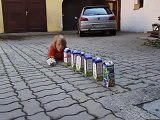 Little boy recycling empty milk cartons