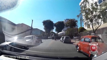 Motorcyclist almost dies hit by a cement truck in Brazil.