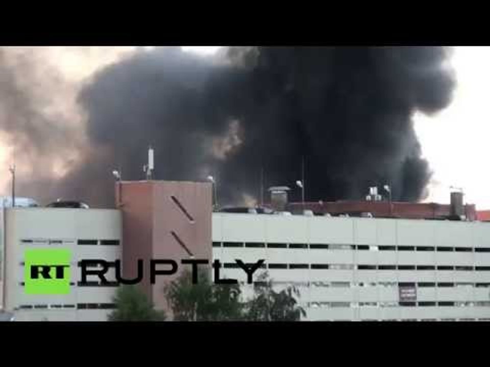 Plumes of black smoke billow into air from burning warehouse in Moscow region