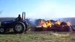 Hay bales burning in a grass fire