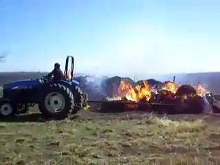 Hay bales burning in a grass fire