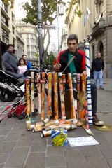 Street drummer wows spectators with plastic pipe jam