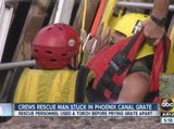 Crews rescue man stuck in Phoenix canal grate