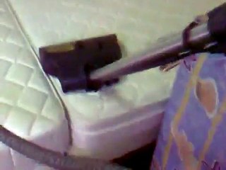 Rainbow E2 Vacuum Cleaner in action on mattress