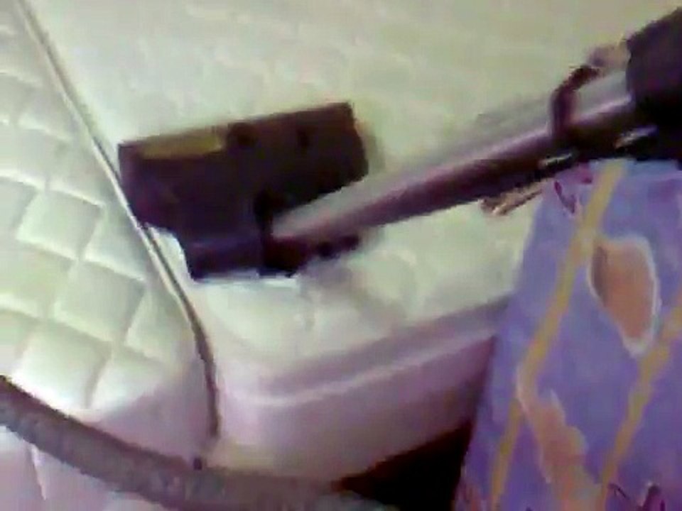 Rainbow E2 Vacuum Cleaner in action on mattress