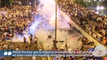 Hong Kong police fire tear gas at protesters outside government offices